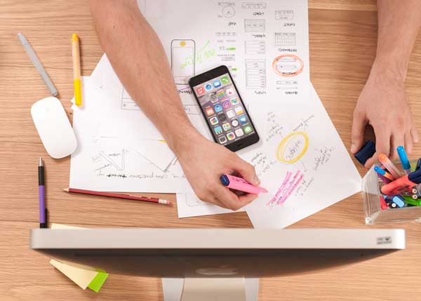 User experience designer creating wireframes for a mobile application development